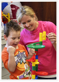 Chrissy-and-CW-student-web Children's Workshop teaches students with autism with positive reinforcement