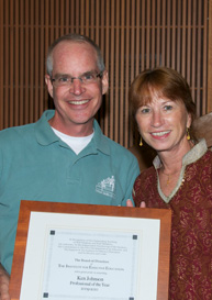 Ken Johnson receiving his award for TIEE's Professional of the Year for 2009-2010 from Executive Director Suzy Fitch